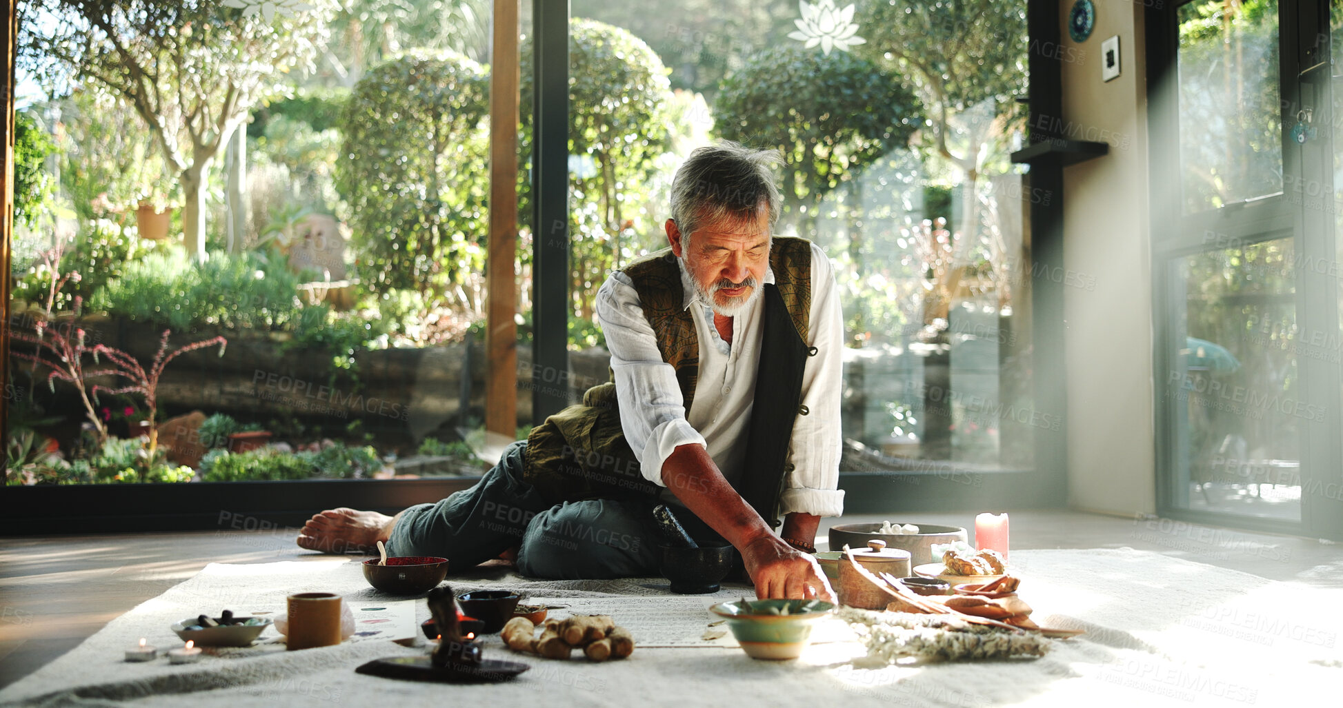 Buy stock photo Crystal, alternative medicine and mature man on floor for spiritual meditation, holistic treatment and healing. Aromatherapy, incense and healer with stones for peace, chakra and detox for wellness