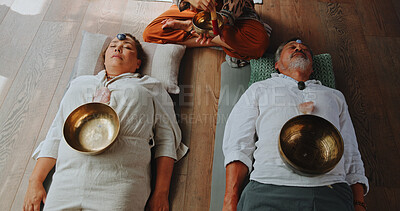 Buy stock photo Tibetan bowl, meditation and energy with couple in studio for spiritual healing, aura cleanse and sound therapy. Holistic vibration, crystal and zen with people for mindfulness and wellness ritual
