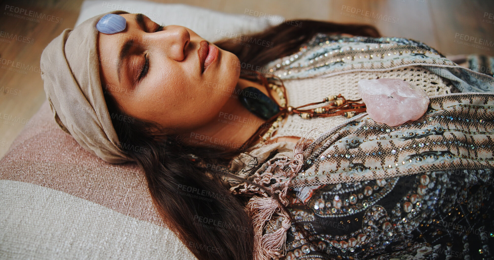 Buy stock photo Woman, crystal and forehead with healing for chakra on floor, energy or rest for therapy on vacation. People, rocks and holistic care with mineral, mindfulness or peace for zen with balance at resort