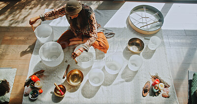 Buy stock photo Sound therapy, woman and healing with naturopath with bowls, ceremony and culture from above. Female healer, ritual and aromatherapy for Buddhism with herbal remedy or natural music with homeopath