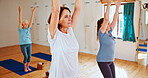 Senior women, stretching and pilates in yoga class for holistic training, mindfulness or wellness. Elderly, female people or yogi with arms up, health or zen for balance, peace or chakra in studio