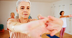 Senior woman, stretching and instructor in yoga class for fitness, exercise and mindfulness for wellness. Elderly person, teaching and pilates for spiritual healing, balance and group at health club