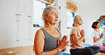 Hands, namaste and senior women with meditation for calm mindset, zen or peace in mental wellness. Posture, morning and people in class together for mindfulness, relax or holistic self care in yoga
