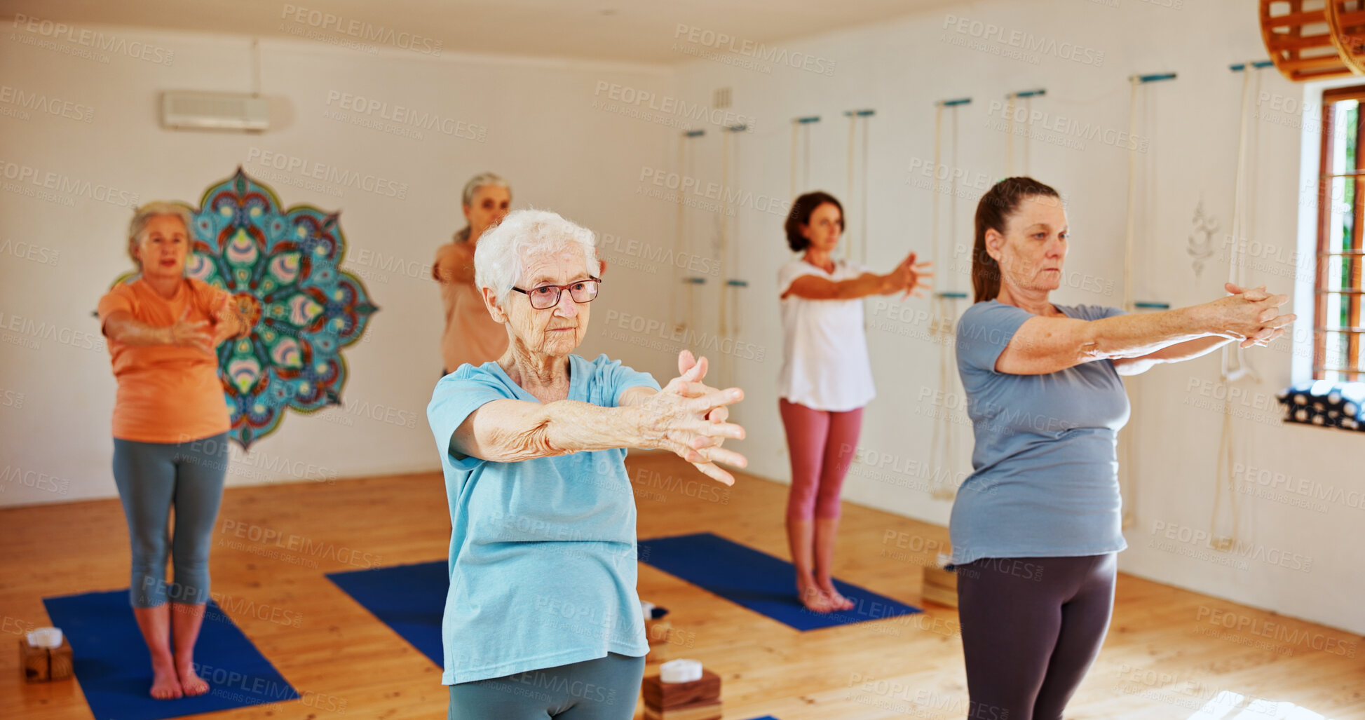 Buy stock photo Yoga class, senior women or exercise with fitness, spiritual wellness or pilates with warm up. Elderly people, retirement or group in health club, stretching or balance with energy, pensioner or calm