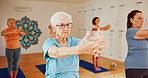 Yoga studio, senior women and fitness with instructor, spiritual wellness and pilates. Elderly people, trainer and group in health club, balance and coach with exercise, retirement and stretching