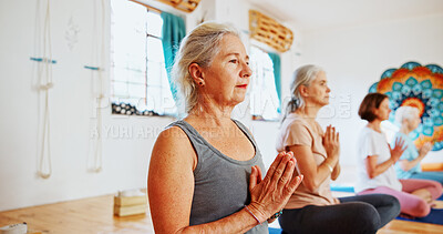 Buy stock photo Hands, namaste and mature women with meditation for calm mindset, zen or peace in mental wellness. Posture, morning and people in class together for mindfulness, relax or holistic self care in yoga