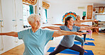 Senior people, stretching and class for yoga with zen, fitness exercise and spiritual wellness. Elderly women, warrior pose and community pilates, holistic practice and body balance at health club