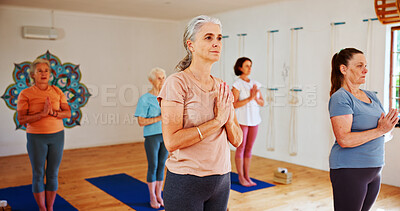 Buy stock photo Senior women, meditation or yoga class with group for holistic exercise, mindfulness or wellness. Elderly, female people or yogi with namaste, health or zen for balance, peace or chakra in studio