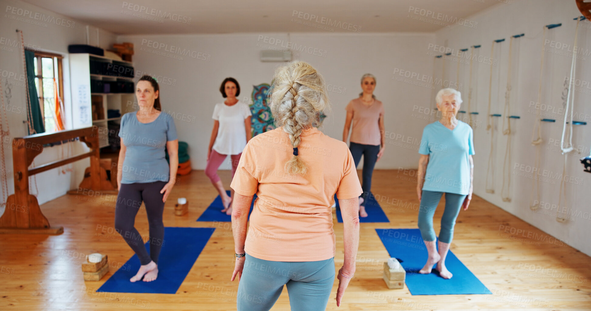 Buy stock photo Yoga class, old women and instructor with fitness, spiritual wellness or balance with energy. Elderly people, calm or group in health club, senior care or pilates with exercise, retirement or support