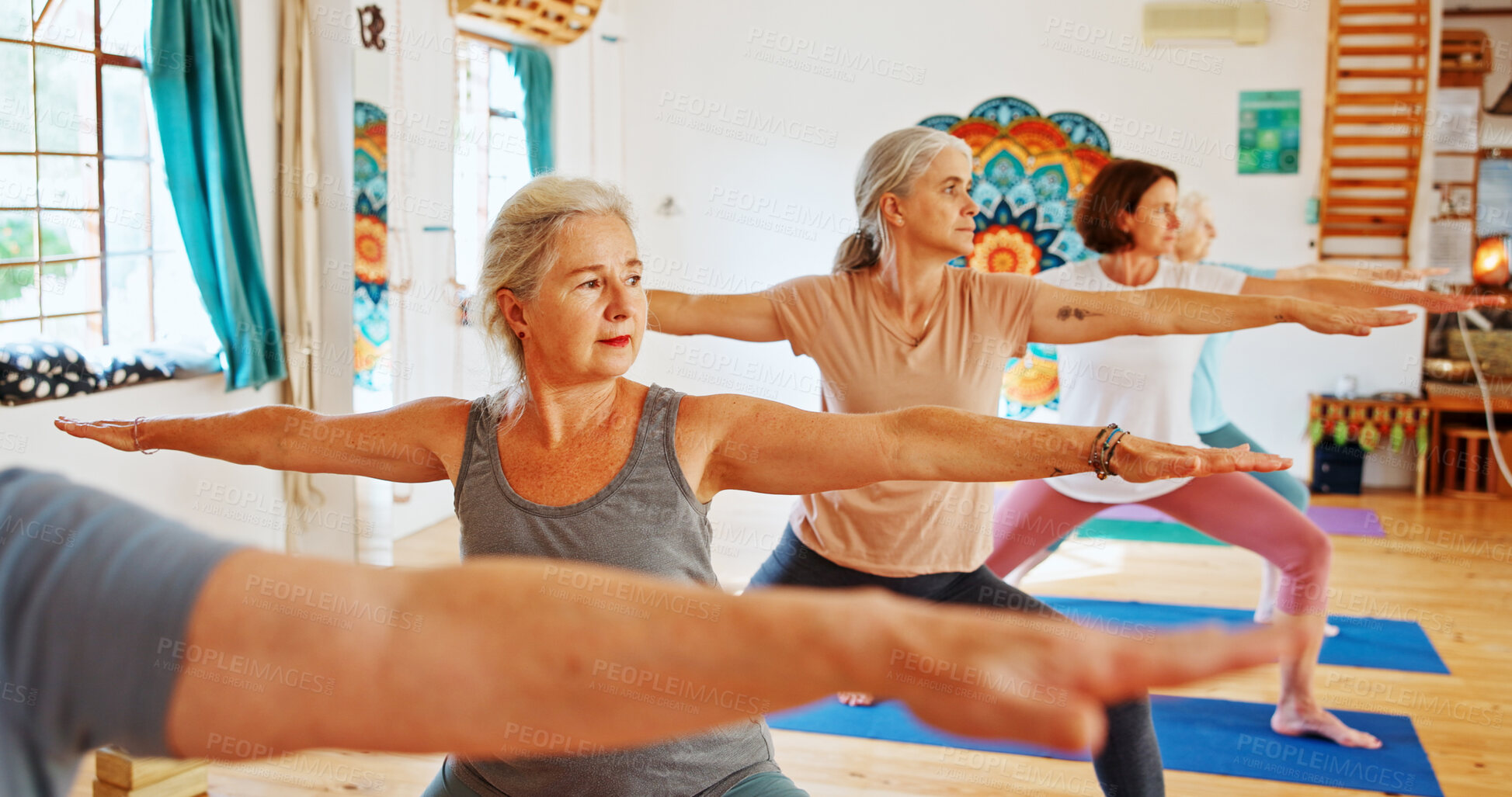 Buy stock photo Elderly people, stretching and class for yoga with zen, fitness exercise and spiritual wellness. Senior women, warrior pose and community pilates, holistic practice and body balance at health club
