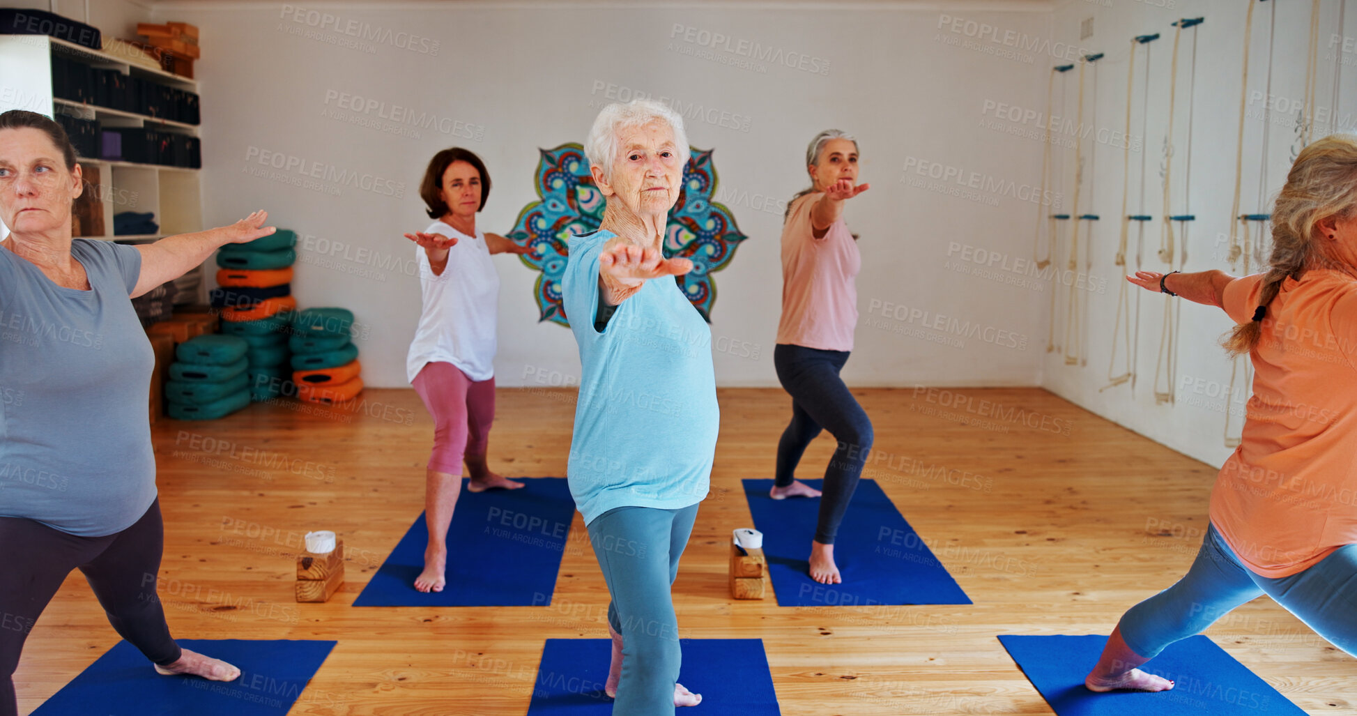 Buy stock photo Senior, people and stretching arms in yoga class for fitness, exercise and spiritual balance for wellness. Elderly women, warm up and warrior pose of pilates lesson, holistic healing and health club