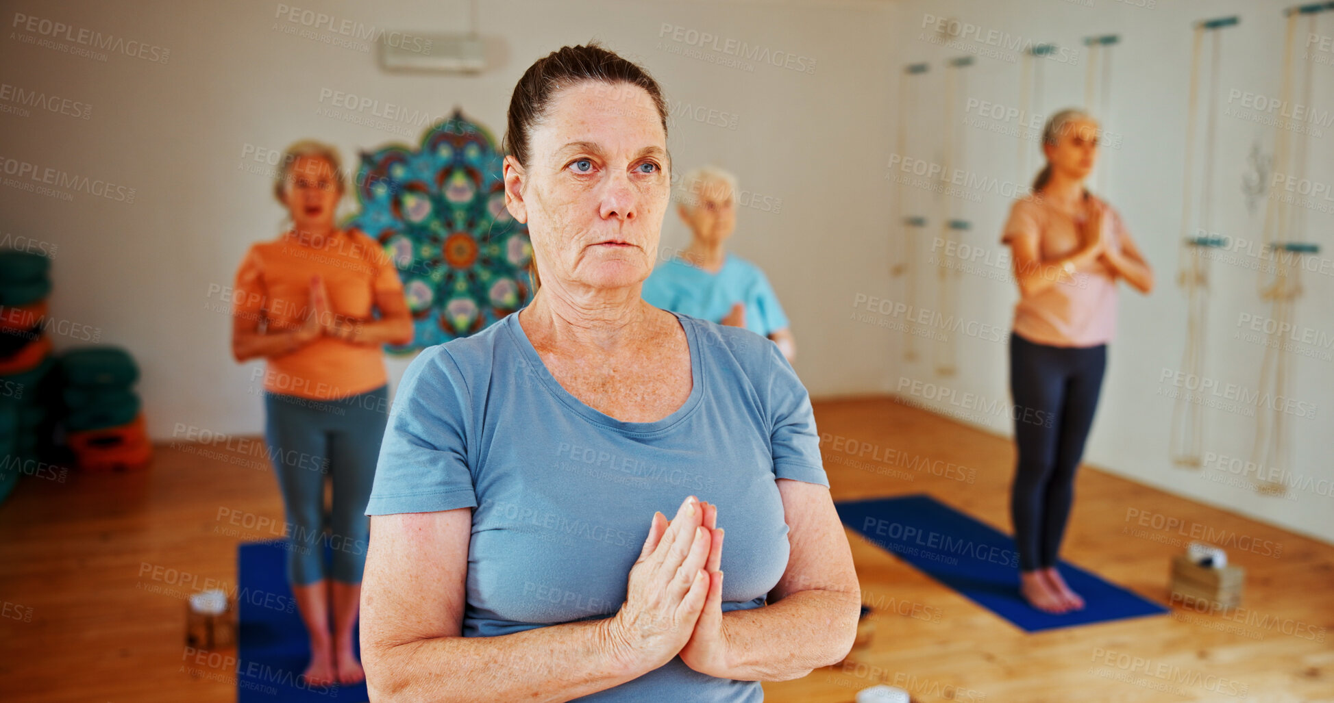 Buy stock photo Breathing, namaste and women in meditation class for calm mindset, zen or peace in mental wellness. Posture, morning and mature people in group together for mindfulness, relax or holistic self care.