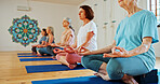 Mature, lotus and women with meditation class for calm mindset, zen or peace in mental wellness. Posture, morning and people in group together for mindfulness, relax or holistic self care on yoga mat
