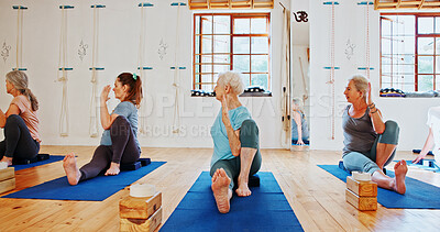 Buy stock photo Group, senior people and exercise for yoga for fitness, flexibility and spiritual wellness. Elderly women, seated twist pose and community pilates, holistic practice and body balance at health club