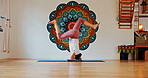 Balance, upside down or yoga and woman in class with wall art for fitness or wellness routine. Exercise, headstand or pilates and yogi person in studio with mandala symbol for holistic health