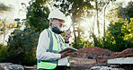 Architecture, radio and tablet with construction worker man on site for communication, development or planning. Building, earmuffs and hardhat with developer person outdoor for industrial engineering