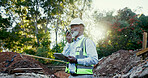 Architecture, radio and tablet with black man on site for communication, development or planning. Building, construction worker and hardhat with African person outdoor for industrial engineering