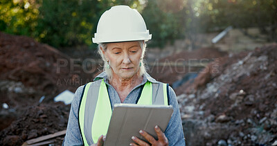 Buy stock photo Building, excavation and tablet with construction worker woman on site for development or planning. Architecture, blueprints and hardhat with mature developer outdoor for industrial engineering