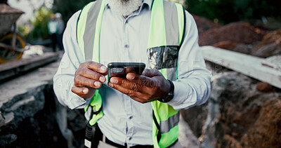 Buy stock photo Construction site, hands and phone with person outdoor for communication, excavation or update. App, building and contact with professional developer typing on mobile for architecture or planning