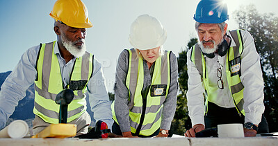 Buy stock photo People, team and outdoor with planning for engineering, check design or collaboration on construction site. Woman architect, mature group and meeting on worksite for brainstorming, compliance and PPE