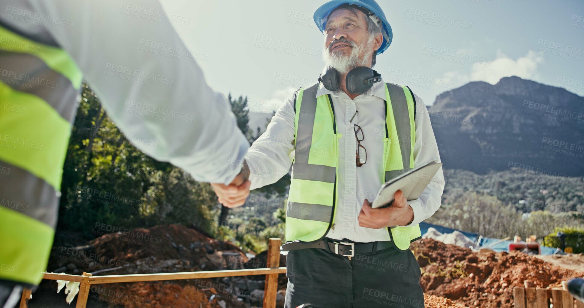Buy stock photo Construction team, collaboration and people shaking hands outdoor for agreement on nature development. Mature man, builder or engineers together for excavation, contract or partnership with handshake
