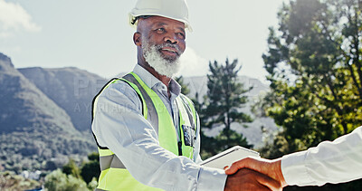 Buy stock photo Collaboration, construction worker and handshake of engineer people outdoor for nature development. Mature man, tablet or partnership for excavation, contract or agreement while shaking hands