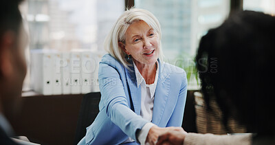 Buy stock photo Business, woman and shaking hands with couple in meeting for investment planning, loan agreement and thank you. Financial advisor, mature person and handshake in office for help with asset allocation