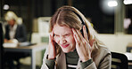 Pain, stress or woman with headache in call center for sales deadline or customer service on break. Night, consultant and exhausted agent in telecom office with fatigue, migraine and burnout crisis