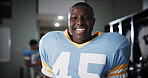 Man, football player or portrait in locker room with smile, gear or ready for tournament. National sport, fitness or happy athlete in cloakroom with confidence, game preparation or competition in USA