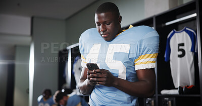 Buy stock photo Football, phone and reading with man in locker room for rookie drafting, pro league research and contact. Game score update, team roster with person for connection, training schedule and player stats