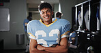 Man, football player or portrait in locker room with arms crossed, gear or ready for tournament. National sport, fitness or athlete in cloakroom with confidence, game champion or competition in USA