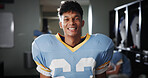 Man, football player and happy in locker room for portrait, gear and confident for tournament. National sport, fitness and athlete in cloakroom with smile, game champion and competition in USA