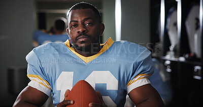 Buy stock photo Man, American football player and ball in portrait in locker room, strong and ready for sports contest. Person, athlete and equipment with confidence, career and serious for competition at club