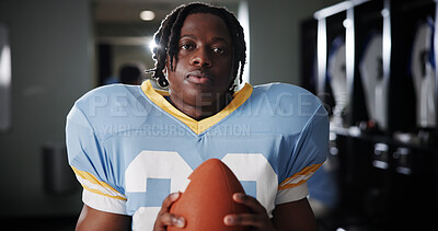 Buy stock photo Black man, American football player and ball in portrait in locker room, strong and ready for sports contest. Person, athlete and equipment with confidence, career and club for competition in USA