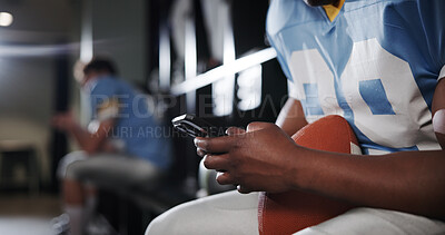 Buy stock photo Football, phone and typing with hands of man in locker room for rookie drafting, pro league research and contact. Game score update, team roster with closeup of person for online training schedule