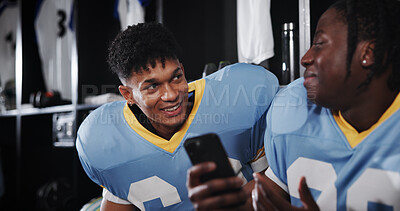 Buy stock photo Football, phone and friends or men in locker room for rookie drafting, pro league research and contact. Game score update, team roster with people for connection, training schedule and player stats