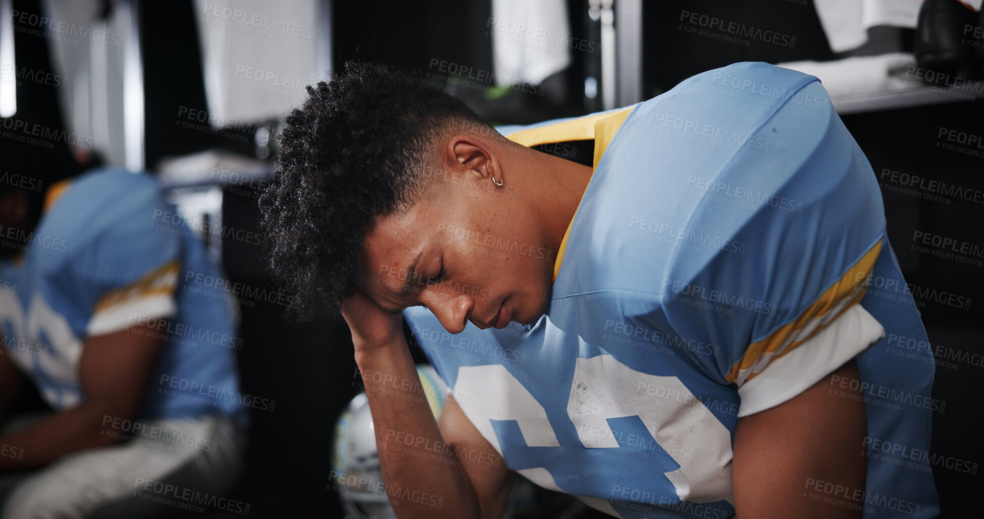 Buy stock photo Man, American football player and headache with stress in locker room, frustrated or concussion with sport injury. Person, migraine and professional athlete with cte, tired and burnout at franchise