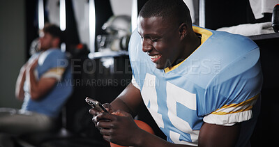 Buy stock photo Football, player and happy with phone in locker room for funny text message, social media meme or match break. Sports, man or relax with smartphone for online news, mobile chat or internet connection