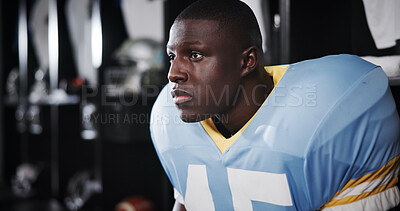 Buy stock photo Thinking, black man and player for football in locker room of match ideas, game plan and half time. Athlete, male person and getting ready with thoughts, sports tournament and competition preparation