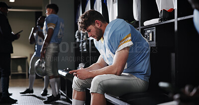 Buy stock photo Football, player and athlete with phone in locker room for reading game plan, check notifications and match break. Sports, man and relax with smartphone for social media, online news and mobile chat