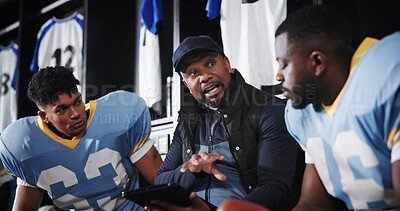 Buy stock photo Man, American football player and coach with team in locker room, tablet and advice for performance. Mentor, professional athlete and discussion for fitness, sports and planning with strategy at club