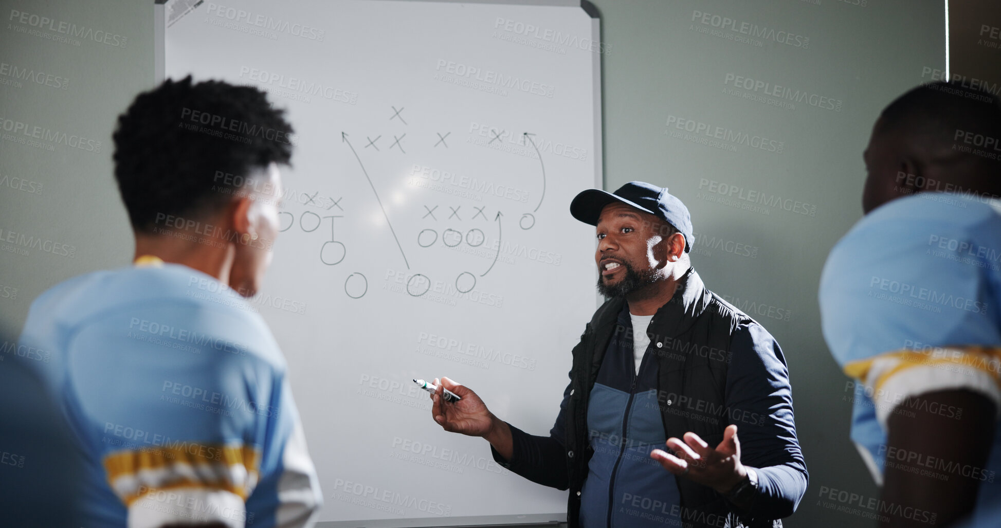 Buy stock photo Board, teaching and football with coach and team in locker room for game plan, sports strategy or defense formation. Touchdown tactics, match feedback and discussion with people and training advice