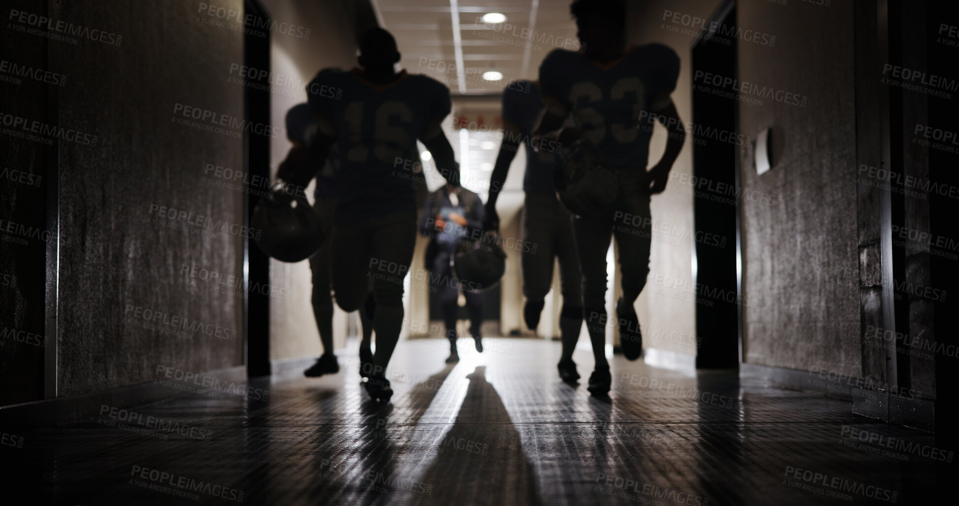 Buy stock photo Light, football and running and team in corridor for sports competition, stadium match and game. Fitness, pro league player and athlete with people in tunnel for training, tournament and contest