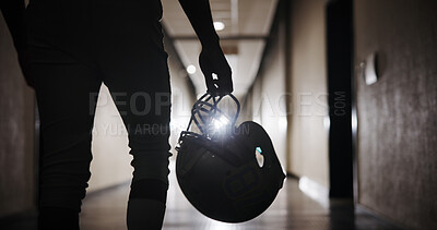 Buy stock photo Helmet, football and hand of man in corridor for sports competition, stadium match and game. Fitness, pro league player and athlete with person in tunnel for training, tournament and contest
