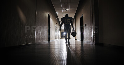 Buy stock photo Back, football and light with man in corridor for sports competition, stadium match and game. Fitness, pro league player and athlete with person in tunnel for training, tournament and contest