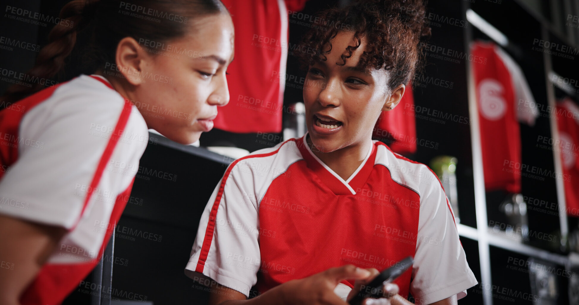 Buy stock photo Sports, team and girls with smartphone, smile and conversation for match on website, watching and online. Locker room, friends and people with mobile for streaming, talking and preparing for game