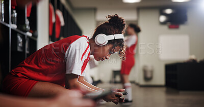 Buy stock photo Girl, soccer player and headphones in locker room for music, sports and inspiration for game. Profile, woman and athlete with streaming, listen and prepare with audio subscription for football match