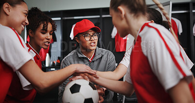 Buy stock photo Women, coach and hands together with soccer ball for teamwork, motivation or collaboration in locker room. Female people, group or sport players piling with stack in huddle for game plan or match
