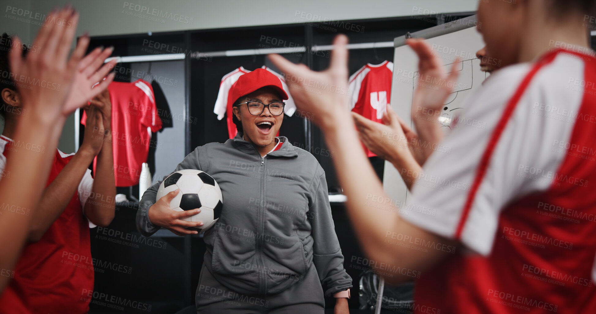 Buy stock photo Women, coach and celebration with soccer team or applause for winning or victory in locker room. Female people, group or sport players clapping with smile for leadership, match or game achievement