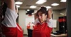 Sport, soccer and women in locker room for stretching, preparation for match with conversation and warm up. Football player, team and people ready for tournament, competition and fitness with chat